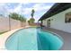Backyard pool and patio area ideal for entertaining and relaxing, complemented by a low block fence for privacy at 3086 Cardinal Dr, Las Vegas, NV 89121