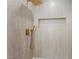 Stylish shower offers gray tiled walls, gold hardware, and a built-in niche at 3086 Cardinal Dr, Las Vegas, NV 89121