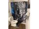 Cozy bathroom features toilet with a shower and a whimsical jaguar-themed curtain at 3128 Spring City Ave, North Las Vegas, NV 89081