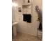 Bathroom with a pedestal sink and decorative wall storage cabinet at 3128 Spring City Ave, North Las Vegas, NV 89081