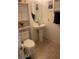 This bathroom includes a toilet, pedestal sink, and decorative shelving at 3128 Spring City Ave, North Las Vegas, NV 89081