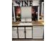 Cozy kitchen area featuring a sink, dishwasher, and playful wine-themed curtains, adding a touch of personality at 3128 Spring City Ave, North Las Vegas, NV 89081