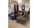 Comfortable living room featuring a sectional sofa, providing ample seating for relaxation and entertainment at 3128 Spring City Ave, North Las Vegas, NV 89081