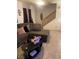 Comfortable living room with plush seating, staircase, and neutral decor, creating a welcoming ambiance at 3128 Spring City Ave, North Las Vegas, NV 89081