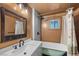 Charming bathroom featuring a classic soaking tub, modern fixtures, and ample vanity space at 4581 Aspen Ave, Mount Charleston, NV 89124