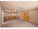 Spacious bedroom featuring hardwood floors, exposed beams, and natural lighting at 4581 Aspen Ave, Mount Charleston, NV 89124