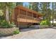 Exterior view of elevated home with covered deck and retaining wall at 4581 Aspen Ave, Mount Charleston, NV 89124