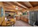 Open concept kitchen with wood cabinets, stainless steel appliances, and seamless flow to the living area at 4581 Aspen Ave, Mount Charleston, NV 89124