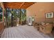 Spacious porch area with cozy seating, perfect for enjoying the views and relaxing outdoors at 4581 Aspen Ave, Mount Charleston, NV 89124
