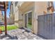 Backyard patio with pavers, artificial turf and a slider door for easy indoor-outdoor living at 4725 Blaise Ave # 103, North Las Vegas, NV 89084