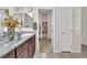 Stylish bathroom featuring granite counters, dual mirrors, and a convenient doorway to the walk-in closet at 4725 Blaise Ave # 103, North Las Vegas, NV 89084