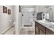 Modern bathroom with a glass-enclosed shower, vanity, and sleek design at 4725 Blaise Ave # 103, North Las Vegas, NV 89084