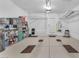 Spacious garage with organized shelving, tool storage, and ample space for vehicles at 4725 Blaise Ave # 103, North Las Vegas, NV 89084