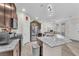 Well-lit kitchen featuring stainless steel appliances, granite counters, and wood floors at 4725 Blaise Ave # 103, North Las Vegas, NV 89084
