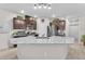 Modern kitchen with stainless steel appliances, granite countertops, and dark wood cabinets at 4725 Blaise Ave # 103, North Las Vegas, NV 89084