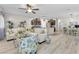 Spacious living room featuring a ceiling fan, modern furnishings, and bright natural light at 4725 Blaise Ave # 103, North Las Vegas, NV 89084