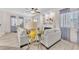 Bright and airy living room featuring large windows, hardwood floors, and fireplace at 4725 Blaise Ave # 103, North Las Vegas, NV 89084