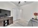 Comfortable living room with tv, closet doors, light flooring and neutral walls at 4725 Blaise Ave # 103, North Las Vegas, NV 89084