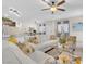 Cozy living room featuring ceiling fan, hardwood floors, and open layout at 4725 Blaise Ave # 103, North Las Vegas, NV 89084