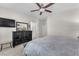 Spacious main bedroom featuring a dresser, ensuite access, and neutral decor at 4725 Blaise Ave # 103, North Las Vegas, NV 89084
