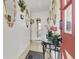 Entryway featuring decorative mirrors, table and white tile flooring creates a welcoming ambiance at 5005 Harmony Ave, Las Vegas, NV 89107