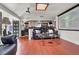 Inviting living room with wood floors, bar, and projector screen at 5005 Harmony Ave, Las Vegas, NV 89107