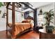 Ornate main bedroom featuring hardwood floors, and canopy bed at 5005 Harmony Ave, Las Vegas, NV 89107