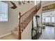 Inviting entryway with staircase, coat rack, and view into the adjacent living room at 5023 Salt River Ave, Las Vegas, NV 89139