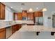 A well-lit kitchen with stainless steel appliances, granite countertops, and a spacious island for food preparation and dining at 5023 Salt River Ave, Las Vegas, NV 89139