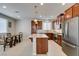 Bright kitchen with stainless steel appliances, granite countertops, and an island, next to the dining area at 5023 Salt River Ave, Las Vegas, NV 89139