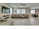 Spacious living room with tile floors, large windows, and modern decor at 5023 Salt River Ave, Las Vegas, NV 89139