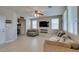 Spacious living room with tile floors, large windows, and modern decor at 5023 Salt River Ave, Las Vegas, NV 89139