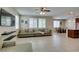 Spacious living room with tile floors, large windows, and modern decor at 5023 Salt River Ave, Las Vegas, NV 89139