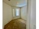 A bright bedroom with a neutral color palette and a window providing natural light at 5147 Progresso St, Las Vegas, NV 89135