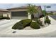 Charming single-story home with a well-maintained lawn and landscaping, plus a two-car garage at 5147 Progresso St, Las Vegas, NV 89135