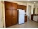 Kitchen view featuring abundant wood cabinets and stainless steel refrigerator at 5147 Progresso St, Las Vegas, NV 89135