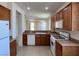 Functional kitchen with light countertops, white appliances, and wood cabinets at 5147 Progresso St, Las Vegas, NV 89135