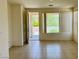 Bright living area with tile flooring, neutral walls, and large windows offering natural light at 5147 Progresso St, Las Vegas, NV 89135
