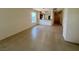 Open-concept living room with tile flooring and a view of the kitchen at 5147 Progresso St, Las Vegas, NV 89135