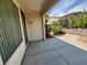 A covered patio area with desert landscaping and a view of neighboring houses at 5147 Progresso St, Las Vegas, NV 89135