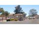 Exterior of the gated entrance featuring fencing, a guard house, and shrubbery at 5155 Gray Ln, Las Vegas, NV 89119