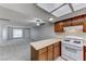 Bright kitchen boasts an eat-in bar, plenty of counter space and an open layout to the living room at 5199 Caliente St # 63, Las Vegas, NV 89119