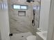 Sleek bathroom featuring tiled walk-in shower, modern fixtures, and white vanity at 532 N 9Th St, Las Vegas, NV 89101