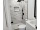 Bathroom with black hardware, white marble tile and a mosaic inset at 532 N 9Th St, Las Vegas, NV 89101