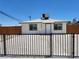 Charming single-story home featuring a black fence, gravel yard, and updated exterior at 532 N 9Th St, Las Vegas, NV 89101