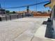 Spacious front yard area featuring gravel, a concrete path, and a view of the neighborhood at 532 N 9Th St, Las Vegas, NV 89101