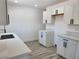 Kitchen with quartz counters, white cabinets, stainless steel hardware and modern appliances at 532 N 9Th St, Las Vegas, NV 89101