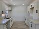 Bright kitchen featuring quartz counters, white cabinets, stainless steel hardware, and vinyl floors at 532 N 9Th St, Las Vegas, NV 89101