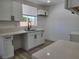 Bright kitchen featuring quartz counters, white cabinets, and stainless steel hardware at 532 N 9Th St, Las Vegas, NV 89101