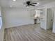 Open floor plan living room and kitchen with vinyl floors and neutral paint at 532 N 9Th St, Las Vegas, NV 89101